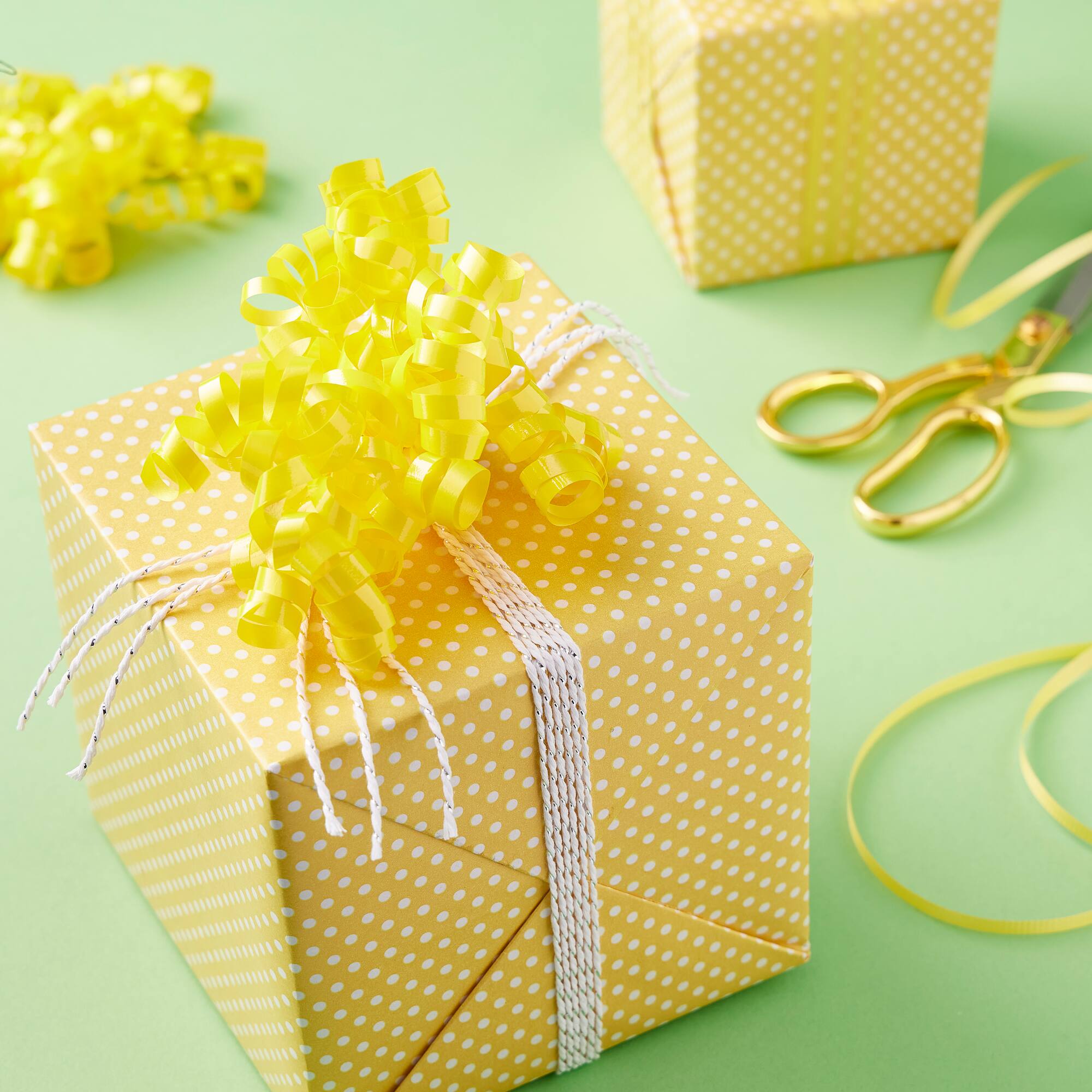 12 Packs: 2 ct. (24 total) 30" Yellow Twisty Bows by Celebrate It™